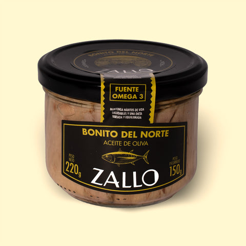 A jar of tuna fillets in olive oil with black and yellow labelling
