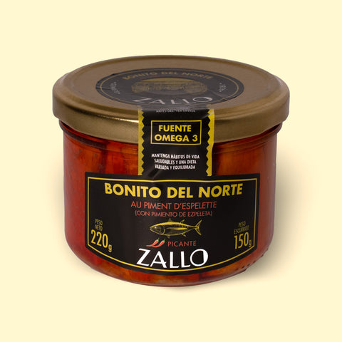 A jar of Zallo tuna fillets in a red-coloured Espelette pepper--spiked sauce with a gold lid and black, gold and red labelling