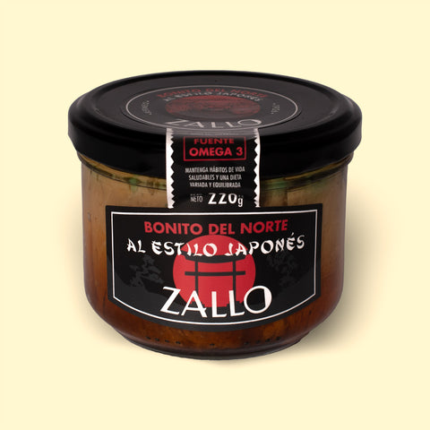 A jar of tuna fillets with a black and red label featuring Japanese iconography against a wood background.
