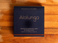 anned white tuna in square blue card packaging with Alalunga in silver, embossed lettering above a diagram of a tuna. There is a copper stripe along the bottom of the packaging.