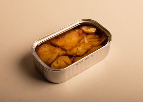open tin of cod in extra virgin olive oil, the picture is very minimalistic 