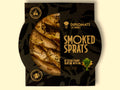 Smoked sprats in extra virgin olive oil, presented in a semi-open black packaging, showing sprats lightly covered in green dill. 