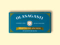 Small Olasagasti anchovy fillets blue packaging on a yellow surface. The design is simple with many details like a Sicilian coat of arms, a golden banner and decorative details on the corners.