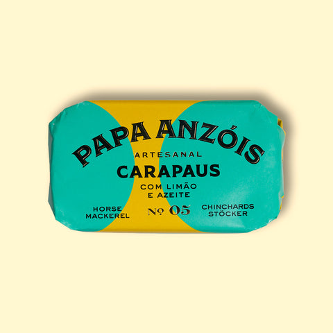 A tin of horse mackerel with lemon and olive oil in rectangular green and yellow packaging. 