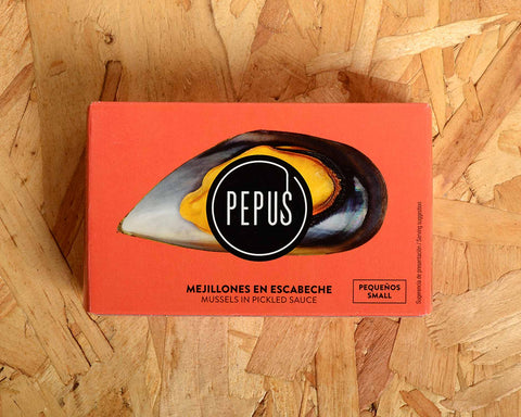 A tin of mussels in rectangular orange card packaging. There is an image of an orange mussel in its shell with the Pepus circular logo overlaid