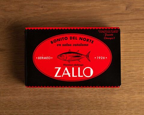 A tin of Bonito del Norte tuna in red and black packaging with a drawing of a tuna on the front and Zallo written in white lettering