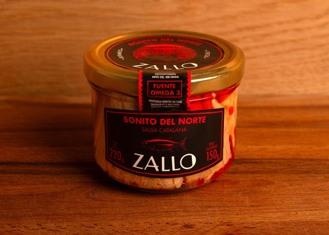 A jar of Zallo tuna fillets in a Catalan sauce with a gold lid and black, white and red labelling