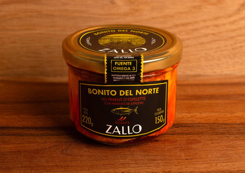 A jar of Zallo tuna fillets in a red-coloured Espelette pepper--spiked sauce with a gold lid and black, gold and red labelling